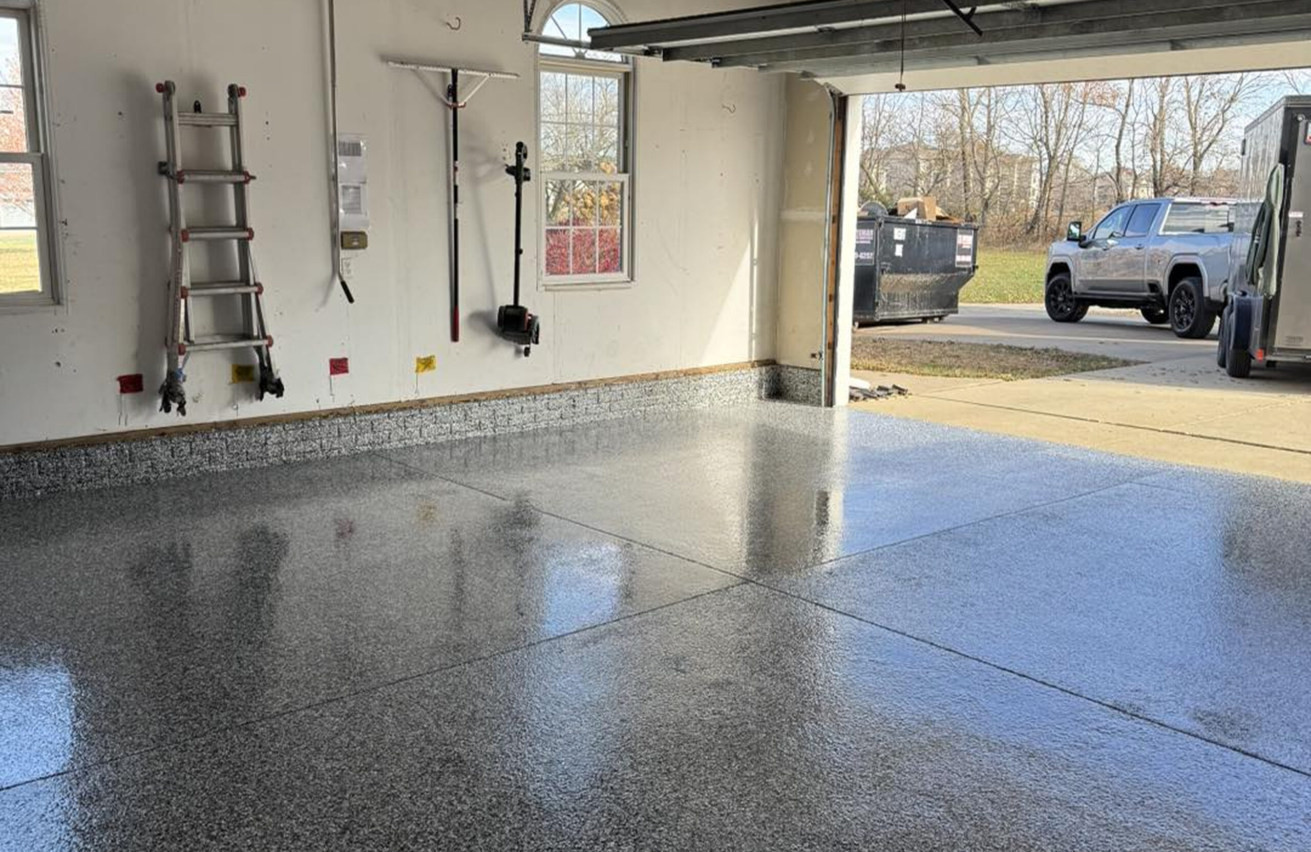 garage with finished, coated floor.